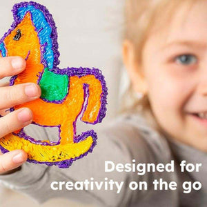 Child holding colorful 3D printed rocking horse made with 3D Magic Pen Set creativity on the go