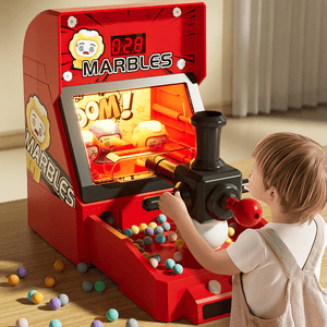 Child playing with red Children's Electric Pinball shooting game machine with colorful marbles and interactive lights