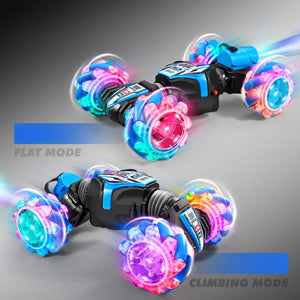 Gesture-sensing off-road drift remote control car with colorful lights and four-wheel drive on rocky terrain