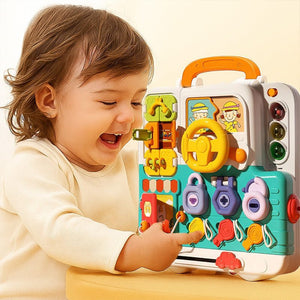 Toddler playing with colorful Busy Board Montessori educational toy for infants with interactive buttons and lights