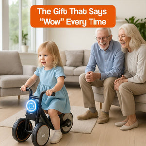 Toddler riding Tiny Biker Anti-Tip Light motorcycle indoors with grandparents smiling nearby