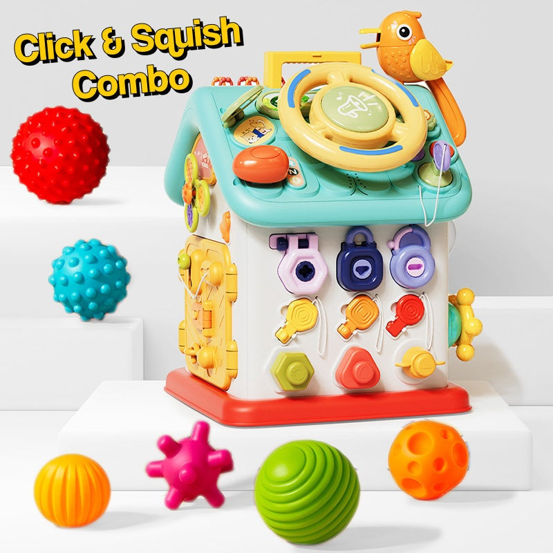 Montessori Busy House toddler toy with interactive buttons, switches, and colorful sensory balls for fine motor skill development.