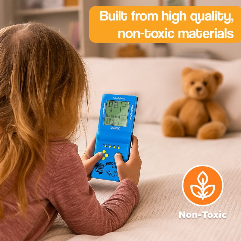 Child playing with 9999-in-1 retro game console handheld device in living room with teddy bear in background