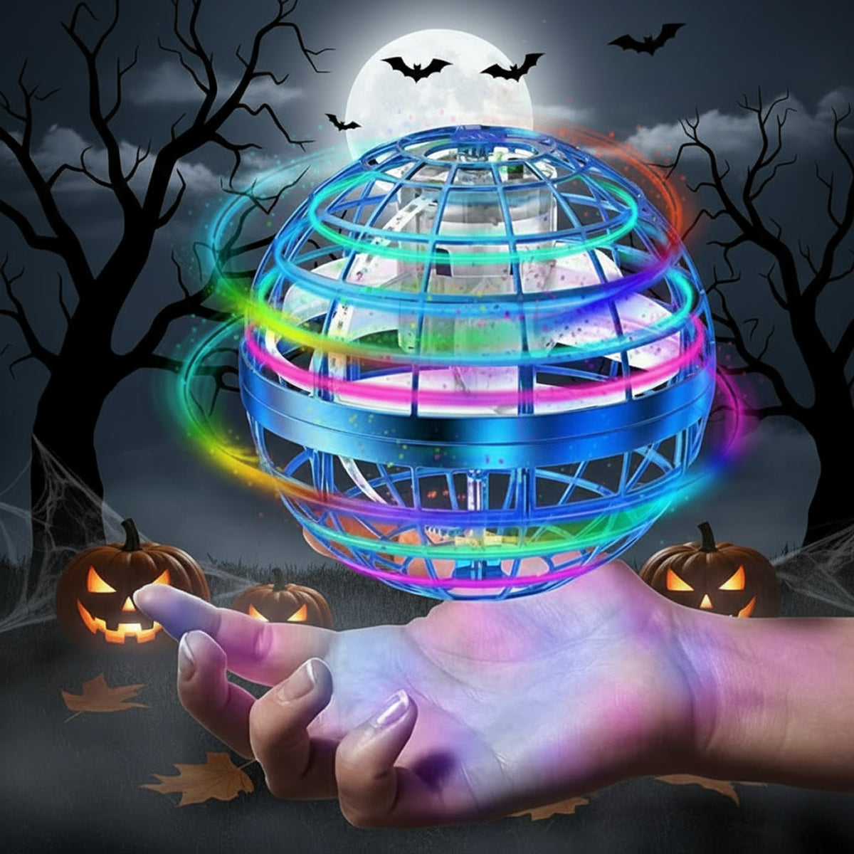 Galaxy Lights Flying Magic Orb glowing with colorful LED lights held over a hand in a spooky Halloween setting with pumpkins, bats, and full moon background